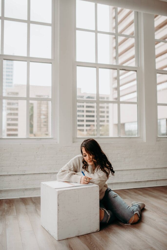 Embracing Change: Reflections for the Season Ahead journaling in a quiet, serene space